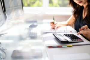 woman calculating her loan needs